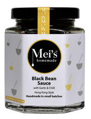 Jar of Mei's homemade black bean sauce with garlic and chili on a white background