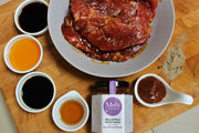 A plate o pork marinated in Miso & Plum Hoisin sauce and other ingredients